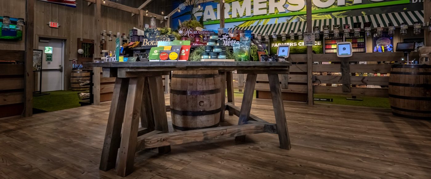 Interior of Farmers Choice dispensary with wooden display table and products